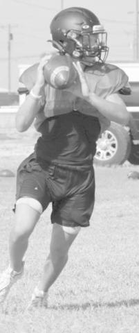 IMPROVISE - Whitharral athlete Brolin Kennedy rolled out for the pass during team practices during two-a-days training. (Staff photo by Aalijah Soliz)
