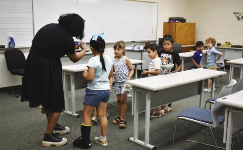 PHOTOGRAPHY CLASS – Pictured are five to six-year-old participants at the SPC Explore the Arts camp last week. Campers had fun taking pictures of each other both indoors and outdoors(Staff photo by Ada Niederhauser)