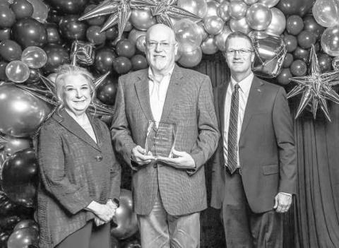 SPC GALA AWARDS -- South Plains College Foundation Board President Ann Capps (left) and SPC President Robin Satterwhite (right) present the 2025 Pacesetter Award to Randy S. Wilson at the College’s 27th annual Scholarship Gala on Feb. 21 at the Mallet Event Center. (SPC Photo)