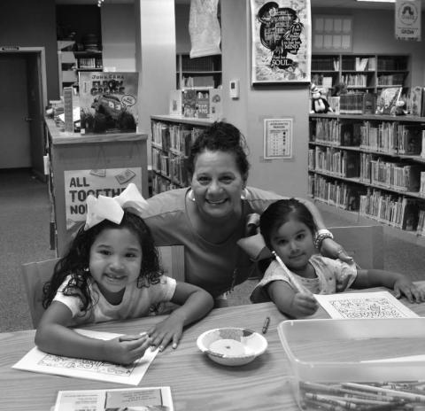 MAKING MEMORIES - Norma Castantino spendt time with her granddaughters Ariel Escobar and Xiomara Escobar at the Hockley County Library. The group participated in the reading program on Wednesday at the Hockley County Library where they enjoyed many activities this summer. (Staff photo by Emily Campos)