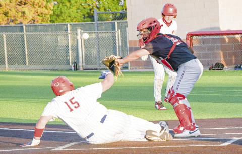 HE’S SAFE! - Sundown’s Ollen Pearson slides into home plate and scores a run while the ball goes astray during their second game against Seagraves this past Tuesday night at Sundown High School. (Staff photo by Jentezen Smith)