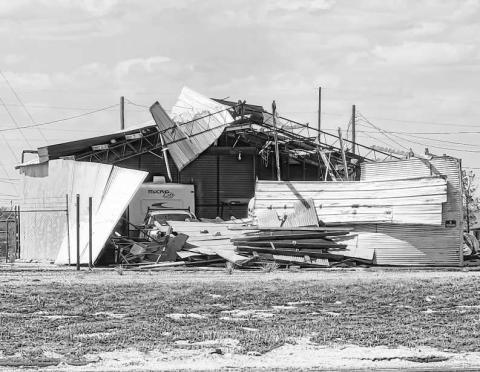 AFTERMATH – Many residents within Levelland will be figuring out their next steps following Wednesday’s storm as damages to homes, businesses and property were immense. Pictured is a building along W. Highway 114 that suffered extreme damages due to the storm’s high winds. (Staff photo by Dom Puente)