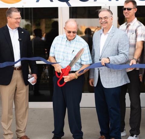 South Plains College Board of Regents Chairman Mike Box was joined by SPC President Robin Satterwhite, board of directors, city administration and businesses to cut the ribbon on new Aquatic Center.
