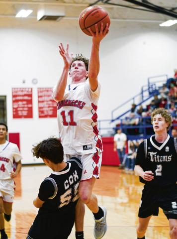 POWELL IN THE PAINT - Sundown Roughneck Kye Powell goes up for the basket in the paint during their game at home against the Lubbock Titans this past Friday night. (Staff photo by Jentezen Smith)