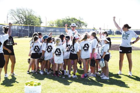 BREAK OUT - Campers and coaches break out to go to stations. The Ropes Softball Camp focused on softball skills as well as good teamwork and sportsmanship skills.