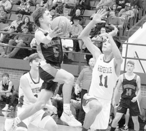 BLOCK ATTEMPT- The Whiteface Antelopes knocked off the Whitharral Panthers at home 53-50. Antelope Jeremias Chavez attempted to block Jack Griffin’s lay-up attempt. (Photo Courtesy of Janie Fryar)