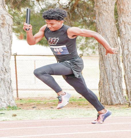 LEAD RELAY LEG - Whitharral Panther Brent Robinson leads off their 4x100-meter relay this past Friday at the Regional Championships at South Plains College. (Staff photo by Jentezen Smith)