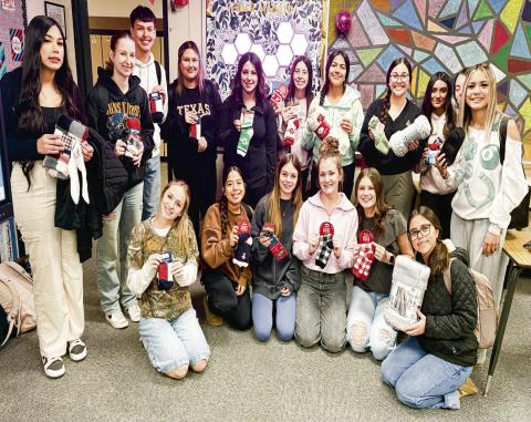 LEVELLAND VOLLEYBALL GIVES BACK - The Levelland High School volleyball program donated socks and blankets to Hickory Terrace Assisted Living last week. Pictured in no particular order is Diana Roman, Azure Wheeler, Bradyn Perez, Evony Vargas, Ava Garza, Jurney Hernandez, Jackie Mercado, Zuriyah Vargas, Katelyn Mendoza, Hayden Almaguer, Darlene Pina, Abigail Heseman, Zaylee Paredez, Hannah Murillo, Lola Potter, Kamryn Navarro and Siomara Ponce.