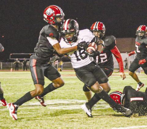 TOUGH RUNNING - Levelland Lobo Noah Martin ran through one Brownfield defender to meet another one past the line of scrimmage this past Friday against the Brownfield Cubs. (Staff photo by Aalijah Soliz)