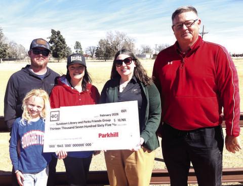 Sundown Rough Friends received a grant for improvements at the community softball field - (left to right) Chad, Amanda and Haidyn Harrall, Susan Dietz, treasurer of Roughneck Friends, and Ron Holson, Sundown councilman.
