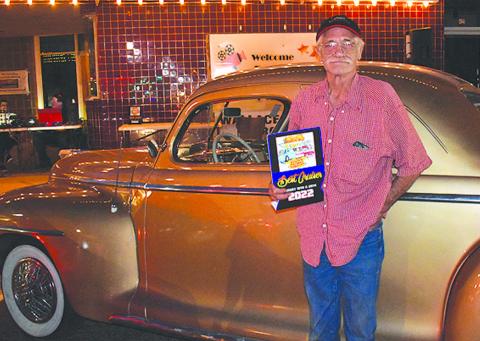 1947 PLYMOUTH– Mark Moyer of Levelland received a People’s Choice award for his golden beauty, a 1947 Plymouth, in the annual Thunder on the Plains Cruise Friday night. Moyer purchased the classic car a year and a half ago and has thoroughly enjoyed taking it to car shows. (Staff Photo)