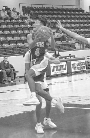 ATHLETIC FINISH - Whiteface Antelope Jeremiah Rendon made the tough layup during the team’s first game of the tournament against Farwell in Littlefield. The Antelopes will face off against the Plains Cowboys this Tuesday on the road at 7:30 p.m. (Staff photo by Aalijah Soliz)