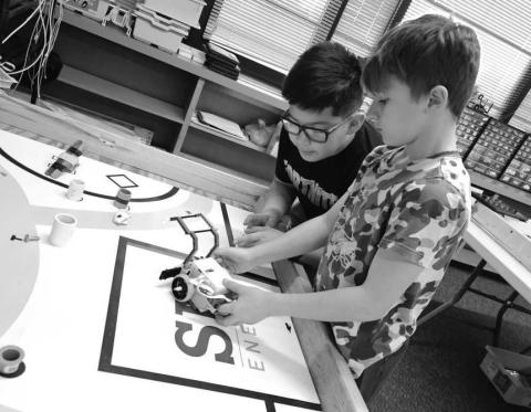 GEARING UP - Capitol students are preparing for their Robotics competition under the direction of Mrs. Clara Sanders. The Robotics students have been working and practicing with coding to control their robots. They get their new theme and maps on February 1, for this years competition. Pictured are Harrison Randol and Leonardo Ochoa Perez. (Photo courtesy of Cristal Isaacks)