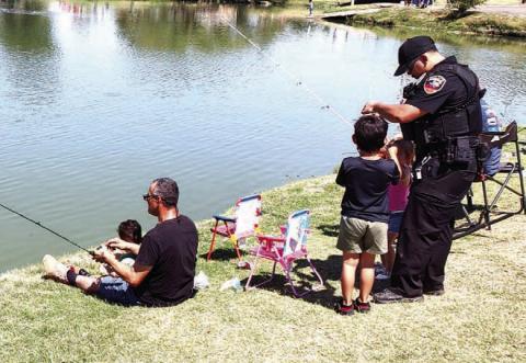 CASTING WITH COPS – Pictured are participants in Saturday’s Casting with Cops event at Lobo Lake. The second annual event featured fishing, lunch provided by the Lions Club and a chance to get to know local law enforcement. (Staff photo)