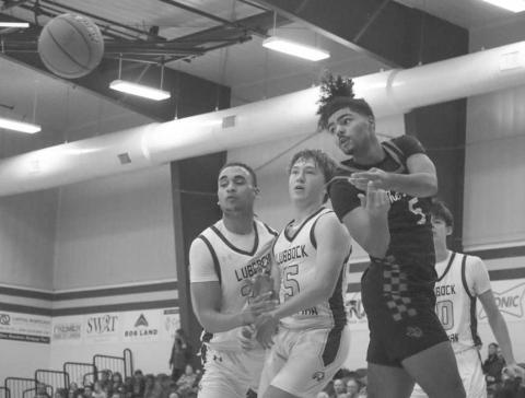 FLASHY PASS - Levelland Lobo Sean Landrum passed the ball behind his back to an open teammate during the team’s game this Thursday in Lubbock. (Staff photo by Aalijah Soliz)