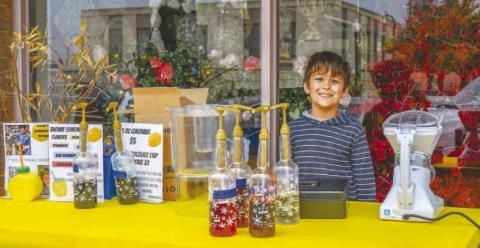 - Liam Gonzales volunteered his time making snow cones on Saturday for Levelland’s Lemonade Day. (Staff photo by Hannah Woodrum)