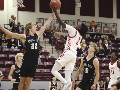 CONTROL - Levelland Lobo Elijah Jordan layed the ball up against the Bushland defense during their contest last week in the Littlefield Tournament. (Staff photo by Aalijah Soliz)