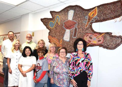 MOSAIC’S NEW HOME-- Levelland ISD on Thursday moved the 1975 Lobo mosaic on Thursday. It now has a new home after being mounted at the Levelland ISD Central Office on 704 11th St. Joining LISD administration for the relocation were 1975 juniors Margarett Dailey-Locket and Rhonda Bradley. (Staff photo by Lynda Work)