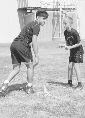 PRACTICE- Morton athletes and students Luis Aguirre and Rylon Alvarado learned route running from the Morton coaching staff on how to line up in different techniques. (Staff Photo by Aalijah Soliz)