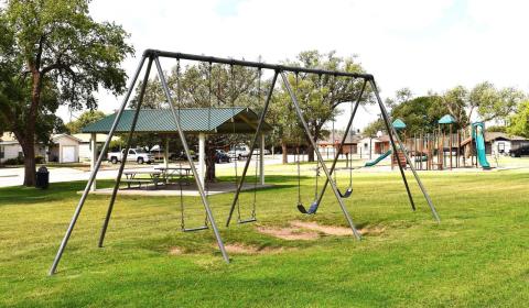 17TH STREET PARK – Also known as Double U or Triangle Park, the park on 17th Street has swings, a pavilion and a playground. It is also conveniently placed, making it a great place for neighborhood gatherings.(Staff photo by Ada Niederhauser)