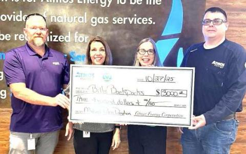 MUCH NEEDED DONATION- Michael Palma and Atmos Energy donated $3,000 to Bill’s Backpacks to support the organization’s efforts to fight hunger. (