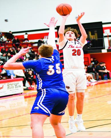 LONGORIA PULLS UP - Levelland Lobo Zavien Longoria pulls up from mid-range during their home game against Lubbock Christian this past Thursday night. Longoria would have four points in the loss. (Staff photo by Jentezen Smith)