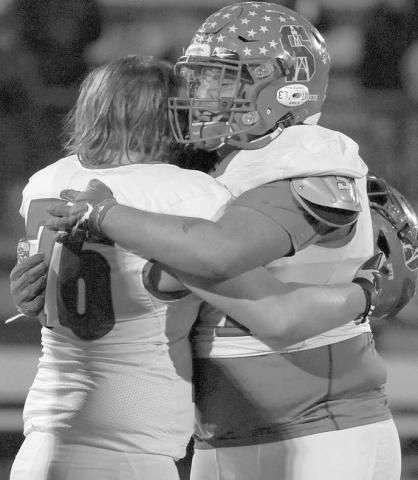 TOUGH NIGHT FOR SENIORS- Roughneck seniors Landon Sehon and Jeff Rodriguez console each other after they were eliminated from the playoffs. The Sundown Roughnecks’ football season came to an end Thursday night in Hereford with a 49-8 loss to the defending Division 2 State Champion Stratford Elks. (Photo Courtesy of Chris Bratcher)