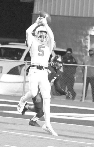 CATCH IN TRAFFIC- Ropes receiver, Colton Mortensen, makes a catch over the middle and takes it down to the Sudan one-yard line to set up first and goal for the Eagles with 5:47 to play in the opening quarter. The Eagles would score on the next play to take a, 6-0, lead over the Hornets. (Photo by Derek Lopez)