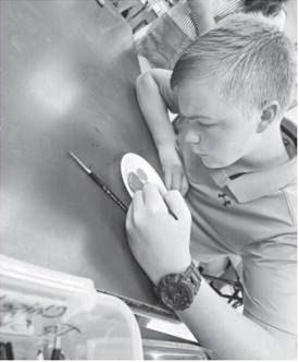 LISD ART CLUB- Art Teacher Kristy Kristenek is ramping up the enthusiasm for art by hosting Art Club every Friday morning. Last Friday, students were caught creating before school. Mrs. Kristenek invites art students in before school for fun projects. Pictures is freshman Kade Gregory. (Photo submitted by Levelland ISD)