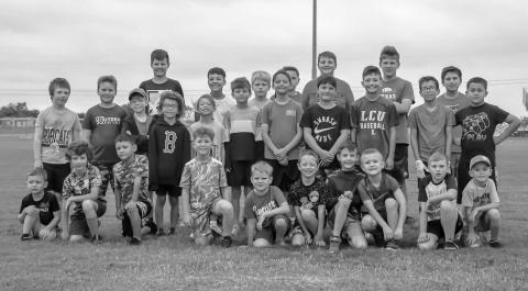 FOOTBALL FUNDAMENTALS - Smyer Bobcat All-Sports Camp participants learned football fundamentals and sportsmanship Wednesday at Smyer High School. The camp was open to incoming second graders through incoming ninth graders. Campers were taught the fundamentals for basketball, volleyball, football and baseball throughout the week. (Staff Photo by Victoria Byrnes)