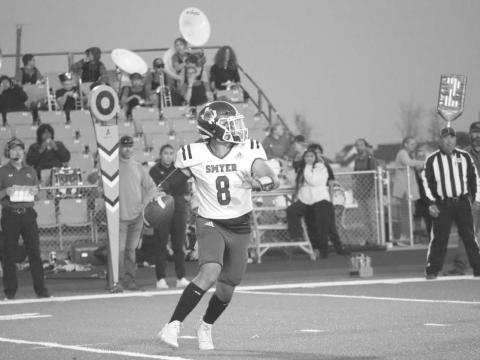 MOBILE - Smyer quarrterback Peyton Casillas made the throw on the run during the teams loss to New Home last Friday during District play. (Staff photo by Aalijah Soliz)