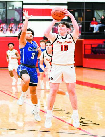 GIBBS FROM RANGE - Levelland Lobo Graham Gibbs shoots a three-pointer during their district basketball game against Lakeview this past Friday night at Levelland High School. (Staff photo by Jentezen Smith)