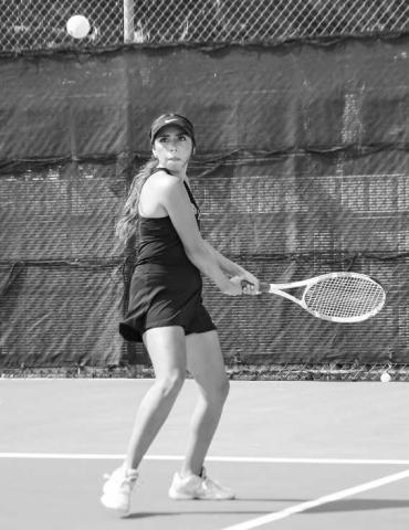 READY TO RESPOND – Daisy Perez gets her racquet and feet in place to make a play on the tennis ball during a match at home against Greenwood this past Tuesday. (Staff photo by Jentezen Smith)