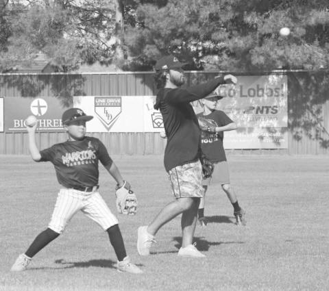 CATCH - Levelland Assistant Coach Brandon Coronado was tossing the ball with some kids at the Levelland Baseball Camp held at the Levelland High School last week. (Staff photo by Aalijah Soliz)