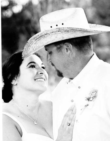 Mr. &amp; Mrs Nicholas Melton exchange wedding vows