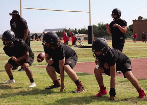 BIG DOGS - The Levelland Lobos linemen were getting to work with drills working with Linemen Coach Marlin Wynn. (Staff Photo by Aalijah Soliz)