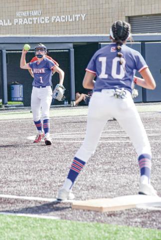 ROUTINE PLAY - Sundown Roughette Breigh Gregory makes a routine out, fielding the ball and throwing it to first baseman Araceli Ibarra during the State Semifinals at Abilene Christian University recently. (Staff photo by Jentezen Smith)