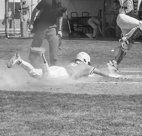 SAFE - Ropes Eagle Branson Simental slid to home plate during the team’s game against the Smyer Bobcats this past Monday as the away team for a earned run. (Staff photo by Aalijah Soliz)