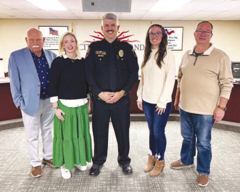 NEW CAPTAIN - Levelland Police Officer Ty Land was promoted to the rank of Captain during Monday’s City Council meeting. Land’s wife, Amy had the honor of pinning Captain Land with his family and fellow LPD officers and staff in attendance. Picture is Captain Land with the Levelland City Council (Staff photo by Dom Puente)