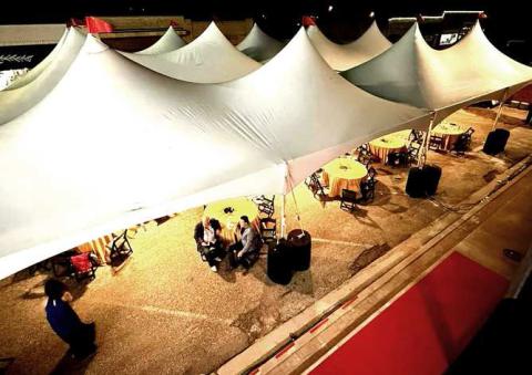 OUTDOOR TENT-- The Wallace Theater grand opening featured a large tent with adorned tables for guest to enjoy food and cocktails. The City of Levelland graciously allowed the street to be blocked off from traffic.