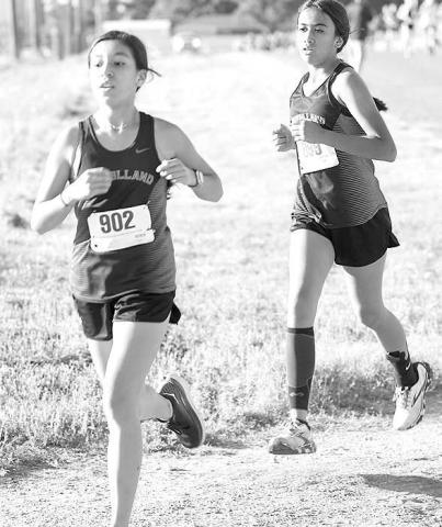 MIDDLE SCHOOL RUNNERS- The Levelland Loboette Middle School cross country team placed fourth at the Sundown Oil Patch Invitational. Pictured are Loboettes runners Avanie Lopez and Madilyn Barrientes. (Photo Courtesy of Debbie Blackshear)