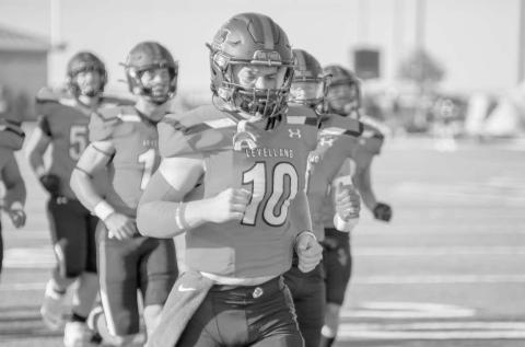 RUN OUT - The Levelland Lobos ran out of the tunnel before their opening regular season game with senior Rusty Johnson leading the way in the Lobos. The Lobos suffered their first loss at home against the Plainview Bulldogs, but looked to bounce back with their first road game against the Snyder Tigers this past Friday. (Staff photo by Dom Puente)