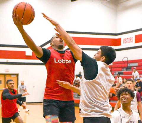 CONTACT FINISH -The Levelland Lobos hosted the Littlefield Wildcats and Canyon Eagles in exhibition matches Thursday at the Levelland Middle School. Pictured is Lobo Jayden Castillo with a tough contact finish in the paint. (Staff Photo by Aalijah Soliz)
