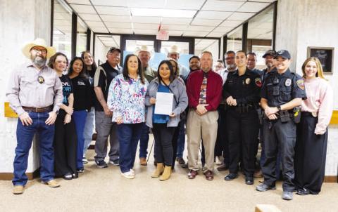 Hockley County commissioners and staff pose for a photograph after signing and approving Sexual Assault Awareness Month. (Staff photo by Eric Venkatesan)