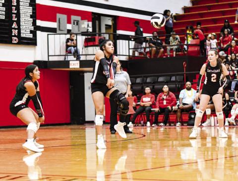 KEEP IT ALIVE – Junior Mia Sepulbeda gets her arms set under the volleyball to keep it in play while her teammates watch during a match at home against Abernathy this past Tuesday. (Staff photo by Jentezen Smith)