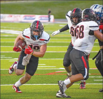 OPEN GAP - Levelland athlete Rusty Johnson ran through the gap that his offensive line made through the Matador defense. The Lobos will face off against San Angelo this Friday as the away team at 7 p.m. (Staff photo by Dom Puente)