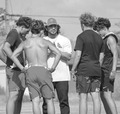 WIDE RECEIVERS - Levelland Coach Brandon Coronado talked to his receiving core this past Thursday during summer workouts at the Levelland High School to go over routes. (Staff photo by Aalijah Soliz)