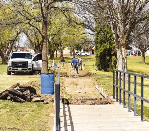 LOBO LAKE IMPROVEMENTS - The Lobo Lake Park is receiving some improvments, as CC Concreate Creations continue to work on the horseshoe walking path. The project is part of a series of upgrades at the park that also include benches and trash cans. The majority of the project is funded through a Texas Parks Parks and Wildlife Grant. (Staff photo by Emily Campos)