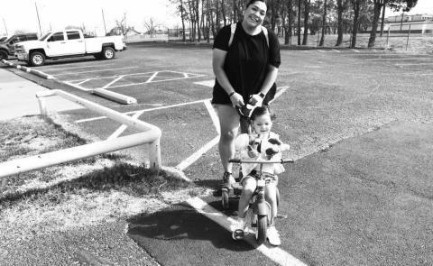 WALK IN THE PARK- Ayreli Calderon and her daughter Alivia Carter went for a walk Tuesday morning around Lobo Lake right before the wind started to pick up. Levelland ISD students and staff are out the week of March 17-21 for spring break. Pictured are Ayreli Calderon, Alivia Carter and her babydoll Jaelie. (Staff photo by Essence Childers).