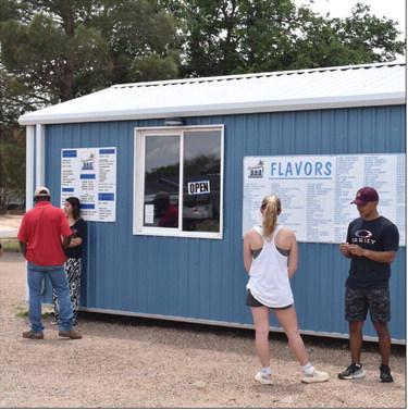 REFRESHING TREAT - Local citizens stopped in for a treat to cool off from the summer weather. (Staff photo by C.R. Calhoun)